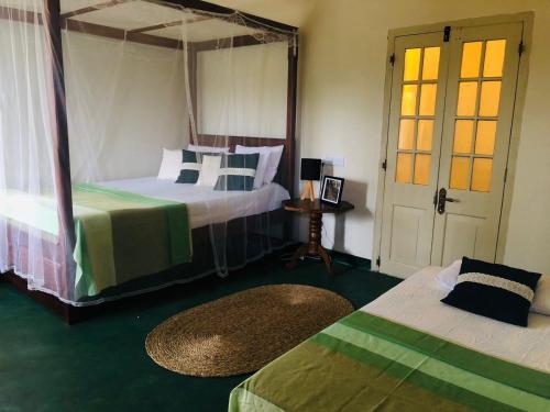 Ένα ή περισσότερα κρεβάτια σε δωμάτιο στο Rathkarawwa Heights