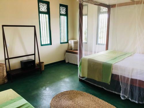 Ένα ή περισσότερα κρεβάτια σε δωμάτιο στο Rathkarawwa Heights