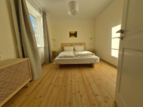 Ένα ή περισσότερα κρεβάτια σε δωμάτιο στο Naturhaus Havelland