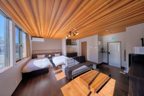 Postel nebo postele na pokoji v ubytování 又楽坊 Matarakubo