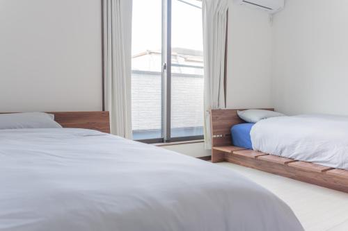 En eller flere senge i et værelse på 똘이하우스 모모다니