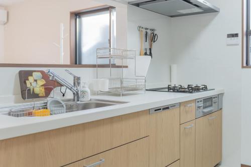 Køkken eller tekøkken på 똘이하우스 모모다니