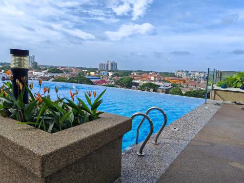 a swimming pool with a view of a city at Suite U Studio 108 in Kota Bharu