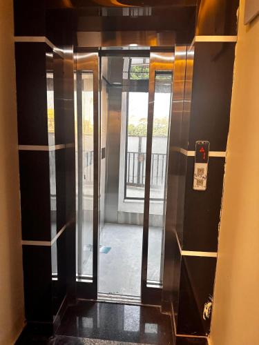 an entrance to a hallway with a glass door at Hotel kapil royal inn in Haridwār
