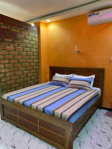 Ένα ή περισσότερα κρεβάτια σε δωμάτιο στο Residence Kuyito 2 Kahone