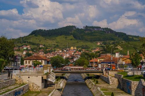 a bridge over a river in a town at Modern Spacious ViS Raska Apartment! 5min Cafes in Raška
