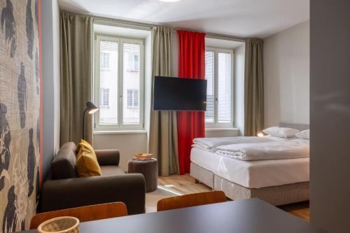 a hotel room with two beds and a table at my Home in Vienna - Erdberg Smart Apartments in Vienna