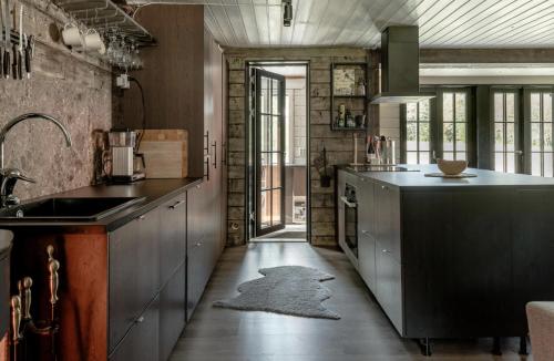 a kitchen with a sink and a counter top at Sälen Osanden in Sälen