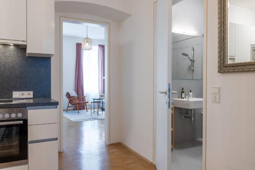 a kitchen with a door leading to a dining room at my Home in Vienna - Erdberg Smart Apartments in Vienna