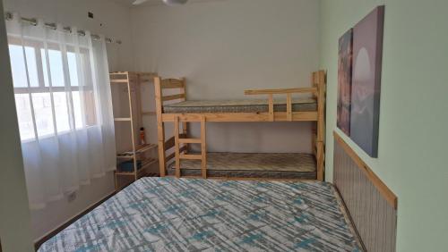 Postel nebo postele na pokoji v ubytování Suites Aconchegantes - Casa da Villa Bertioga