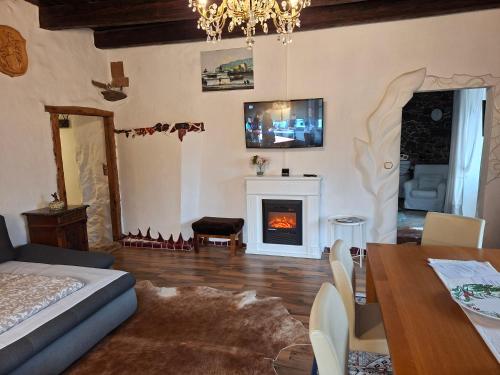 a living room with a bed and a fireplace at Appartement Donaustrand in Bergern