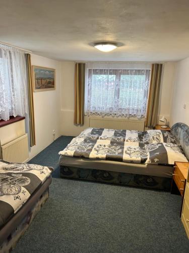 Ένα ή περισσότερα κρεβάτια σε δωμάτιο στο Apartmán u Bětky