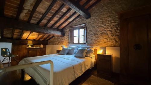 Postel nebo postele na pokoji v ubytování Agriturismo Podere Cortilla