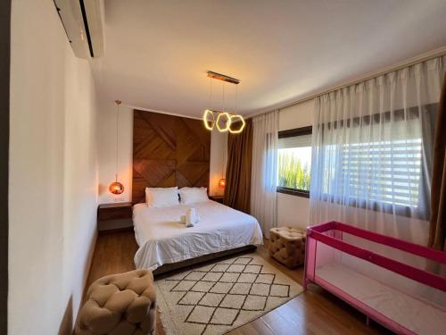 Postel nebo postele na pokoji v ubytování Villa Serena luxe et calme 500 m de la plage