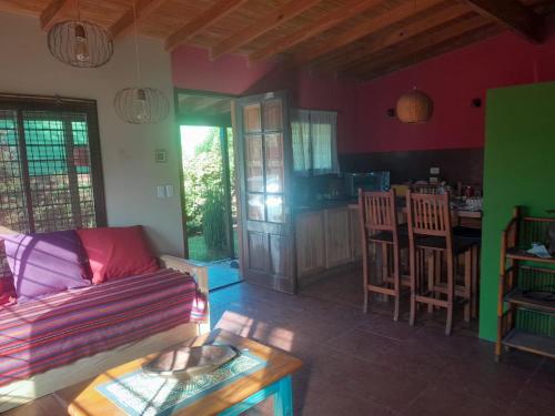a living room with a couch and a table at Alu Antu Camet Norte in Camet