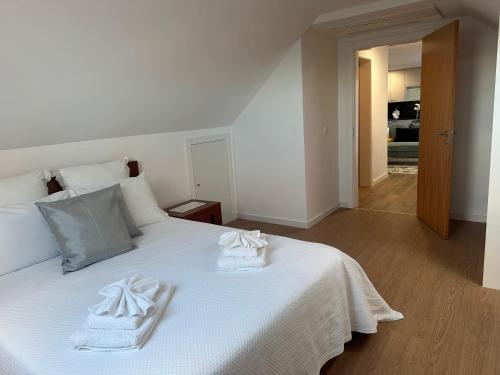 En eller flere senge i et værelse på Refugio da Ponta do Sol 2 - Madeira Inn Group