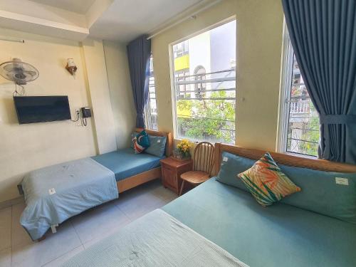 Giường trong phòng chung tại Sông Suối Homestay