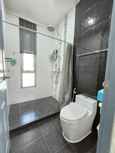 a bathroom with a toilet and a shower at เดอรำพึง2 De ramphueng2 in Ban Chak Phai