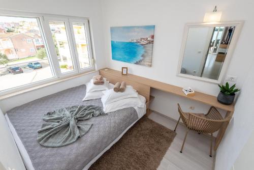 Ένα ή περισσότερα κρεβάτια σε δωμάτιο στο Ferienwohnung für 3 Personen ca 30 qm in Grebastica, Dalmatien Norddalmatien