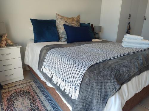 Ένα ή περισσότερα κρεβάτια σε δωμάτιο στο Onewavestay