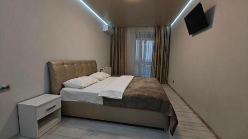 Postel nebo postele na pokoji v ubytování Yarovytsya VIP in the CENTER