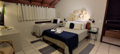 Ένα ή περισσότερα κρεβάτια σε δωμάτιο στο Hotel Pousada da Lagoa