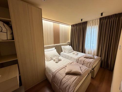 Katil atau katil-katil dalam bilik di Cozy Apartament