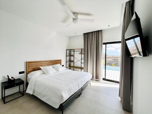Ένα ή περισσότερα κρεβάτια σε δωμάτιο στο Villa la Guancha