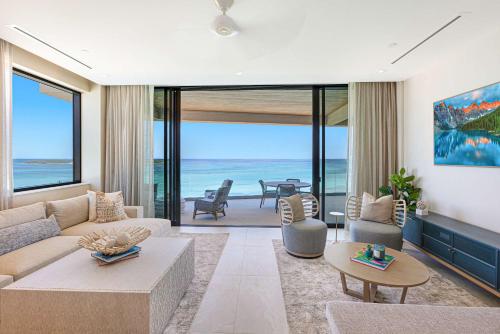 a living room with a view of the ocean at Beachfront 3 bedroom Luxury Residence in Nassau