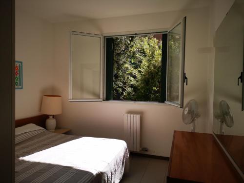 En eller flere senge i et værelse på Punta Ala Bilocale Vista Mare 6 Posti Letto! Punta Ala Monolocale Vista Mare 4 Posti Letto!