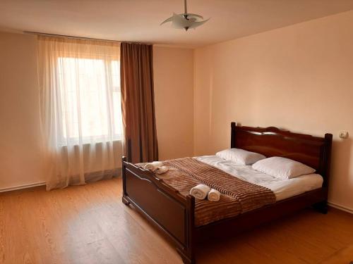 Postel nebo postele na pokoji v ubytování White House Byurakan