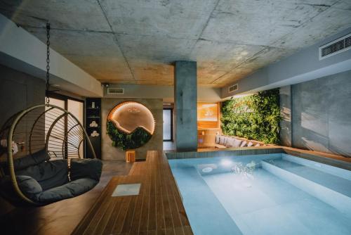 a house with a swimming pool in the middle at TheHouse - Apartment Kamenitza in Velingrad