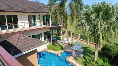 an aerial view of a house with a swimming pool at Wonderful Beach Villa, Perfect Location in Khao Lak
