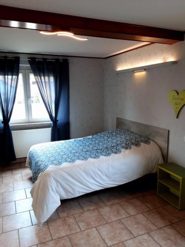 Ένα ή περισσότερα κρεβάτια σε δωμάτιο στο Gîte des Tourtereaux proche Europapark et Rulantica