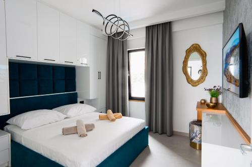 Ένα ή περισσότερα κρεβάτια σε δωμάτιο στο Golden Apartament Saranda