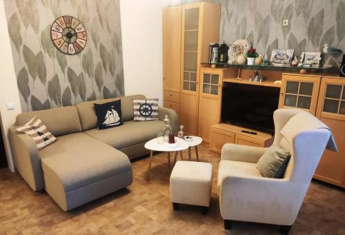 Posezení v ubytování Ferienhaus Emden Zur Mühle Nordseeküste