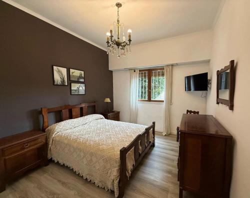 Ένα ή περισσότερα κρεβάτια σε δωμάτιο στο Chalet con Pileta Bandurrias - Mar del Plata