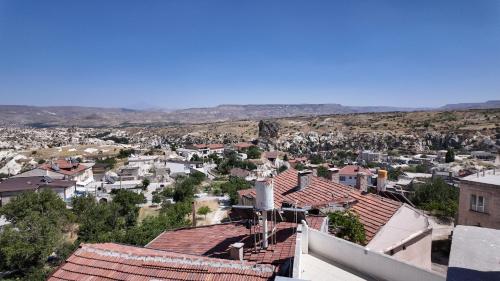 a view of a city from the roof of a building at Gumus Hotel in Ortahisar