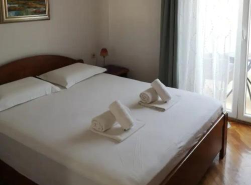 Postel nebo postele na pokoji v ubytování Apartments Nataša