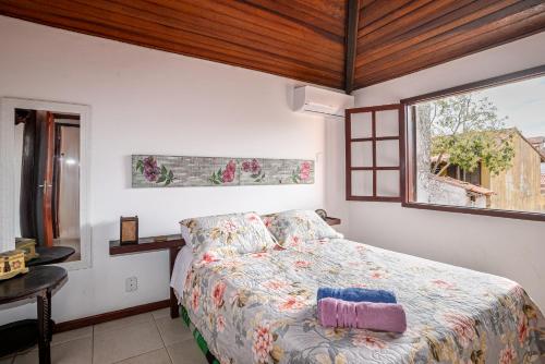 Ένα ή περισσότερα κρεβάτια σε δωμάτιο στο Charmosa casa com piscina em Búzios