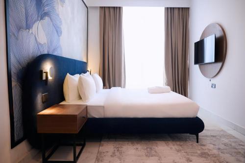 Giường trong phòng chung tại Azusa Hotel and Apartments