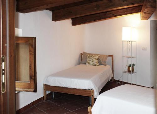 Ένα ή περισσότερα κρεβάτια σε δωμάτιο στο Lumira Vista - Borgo