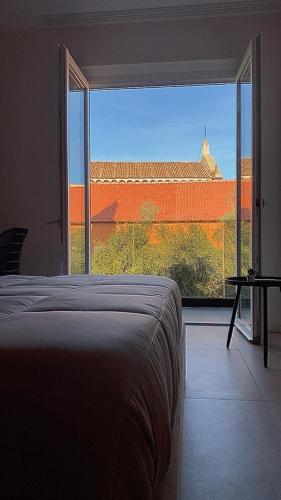 Ένα ή περισσότερα κρεβάτια σε δωμάτιο στο 50 Passi dal Duomo