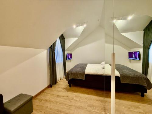 Una cama o camas en una habitación de Centro apartamentai