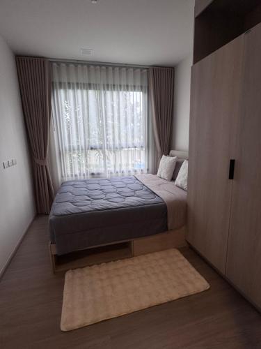 Ένα ή περισσότερα κρεβάτια σε δωμάτιο στο DCondo Kathu ใกล้หาดป่าตอง