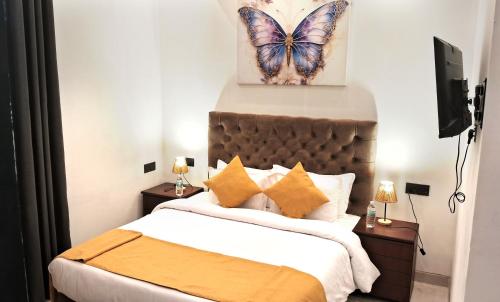 Ένα ή περισσότερα κρεβάτια σε δωμάτιο στο ThiThi's Palace Mirissa