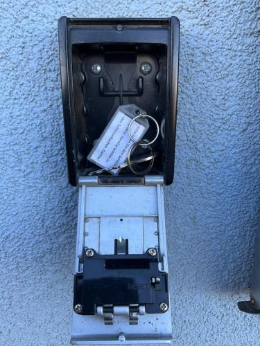 a box with a cell phone and other items in it at Haus TimpeTe am Breetzer Bodden in Vieregge