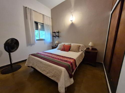 a bedroom with a bed and a window at Oasis in Villa Anizacate