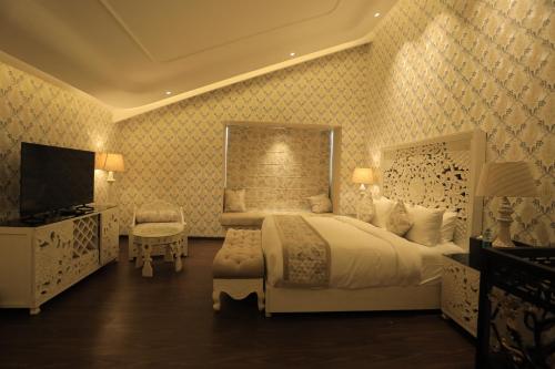 Ένα ή περισσότερα κρεβάτια σε δωμάτιο στο Hotel The Royal Venetian