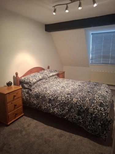 En eller flere senge i et værelse på SPEEDWELLCOMe